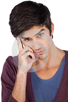 Thoughtful man with hand on face