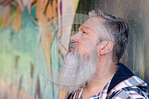 Thoughtful man with a long grey beard