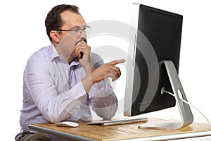 Thoughtful man with mustache pointing at computer