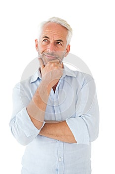 Thoughtful man posing with hand on chin