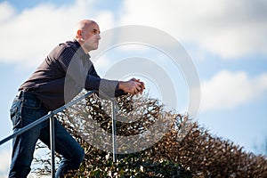 Thoughtful man sitting on a flight of steps