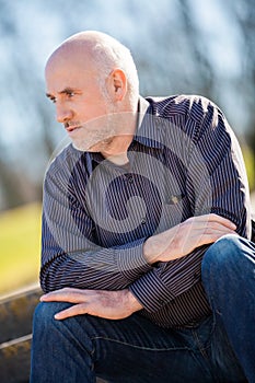 Thoughtful man sitting on a flight of steps