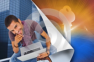 Thoughtful man sitting on floor using laptop and smiling at camera