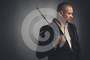 thoughtful man in suit with katana sword