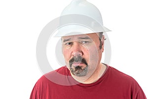 Thoughtful man wearing a hardhat