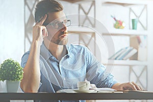 Thoughtful man at workplace