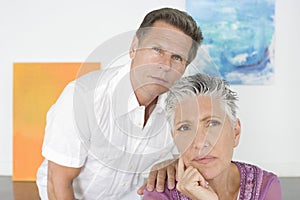 Thoughtful Mature Couple In Art Gallery