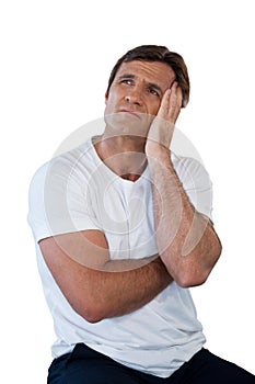 Thoughtful mature man sitting with head in hands