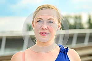 Thoughtful middle-aged woman looking quietly at the camera