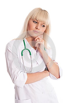 Thoughtful nurse in a white coat