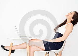 Thoughtful and pensive cheerful and happy young Caucasian business woman thinking with smiling positive expression