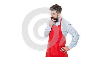 Thoughtful professional business owner shopkeeper thinking business in red apron studio