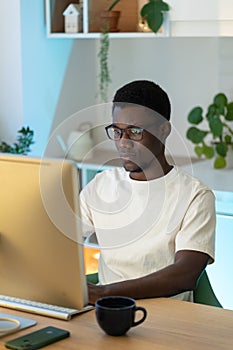 Thoughtful web developer work on computer, programmer trying to find solution for bug in app code