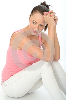 Thoughtful Relaxed Happy Attractive Young Woman Sitting on the Floor