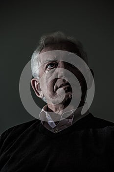 Thoughtful sad elder man
