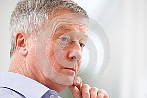 Thoughtful Senior Man At Home