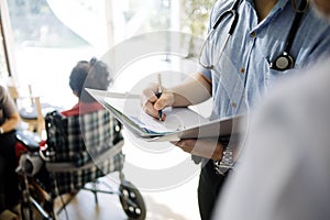 Thoughtful senior man sitting on wheelchair at hospital. Sad disabled on wheelchair at the medical center feeling lonely. Retired