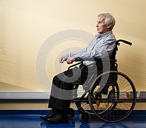 Thoughtful senior man in wheelchair
