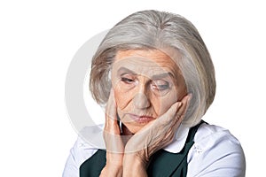 thoughtful senior woman isolated on white background