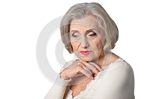 thoughtful senior woman isolated on white background