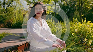 Thoughtful serious elegant dreaming caucasian woman businesswoman model posing in city park worried pensive frustrated