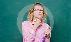 thoughtful student in glasses at blackboard. next school year. Girl prepare for exams. essay writing. teacher with