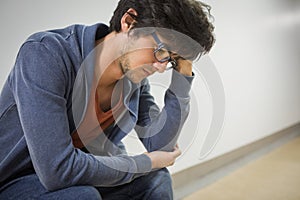 Thoughtful student sitting on chair