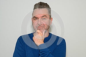 Thoughtful unshaven middle-aged man