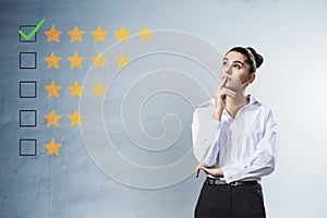 Thoughtful woman with 5 star rating on concrete wall background. Customer service and excellent feedback