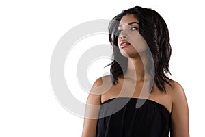 Thoughtful woman against white background