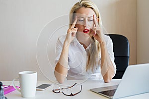 Thoughtful woman concentrating at work