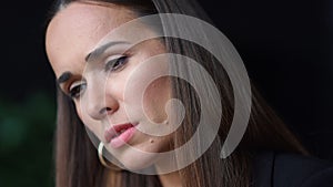 Thoughtful woman face. Closeup serious businesswoman looking down