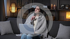 Thoughtful Woman With Laptop And Thinking On Sofa