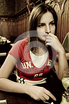 Thoughtful woman in restaurant