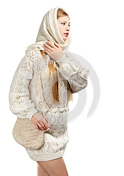 Thoughtful woman in white winter clothing