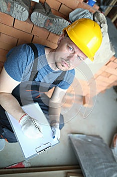 Thoughtful worker in hardhat