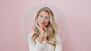 Thoughtful young blonde, chin-hand posture over pink background, shirt-dressed, doubt-ridden expression, questioning reality