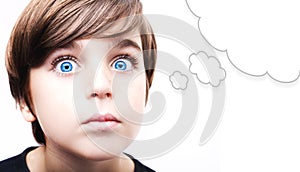 Thoughtful young boy with an empty thought bubble