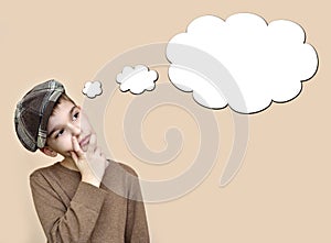 Thoughtful young boy with an empty thought bubble