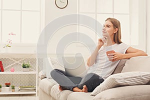 Thoughtful young girl with laptop indoors