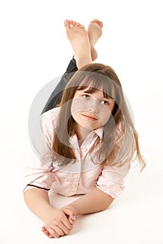 Thoughtful Young Girl Lying On Stomach