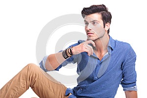 Thoughtful young man looking away