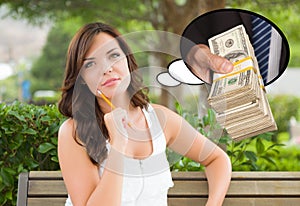 Thoughtful Young Woman with Hand Holding Stack of Money Inside T