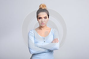 Thoughtful young woman having doubts over background