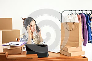 Thoughtfull Asian Female Online Shop Bussiness Owner Busy on Phone