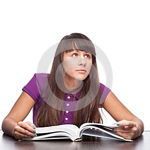 Thoughtfull girl with book