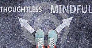 Thoughtless and mindful as different choices in life - pictured as words Thoughtless, mindful on a road to symbolize making
