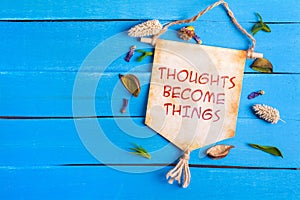 Thoughts become things text on Paper Scroll photo