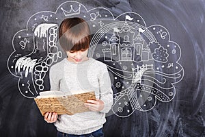 Thoughts of boy against the black chalkboards