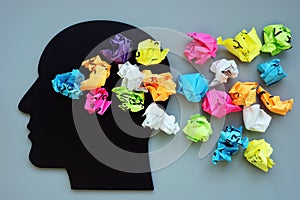 Thoughts, ideas and mindfulness concept. Head and paper balls photo